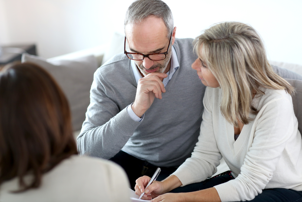 Senior couple meeting financial adviser for investment-1