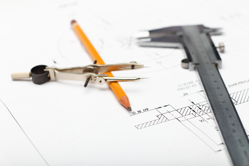 Tools and papers with sketches on the table-1